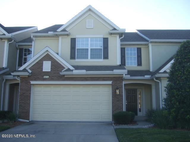 a front view of a house with garage