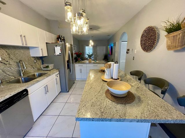 $348,000 | 6962 Northwest 179th Street, Unit 1056 | Country Club of Miami