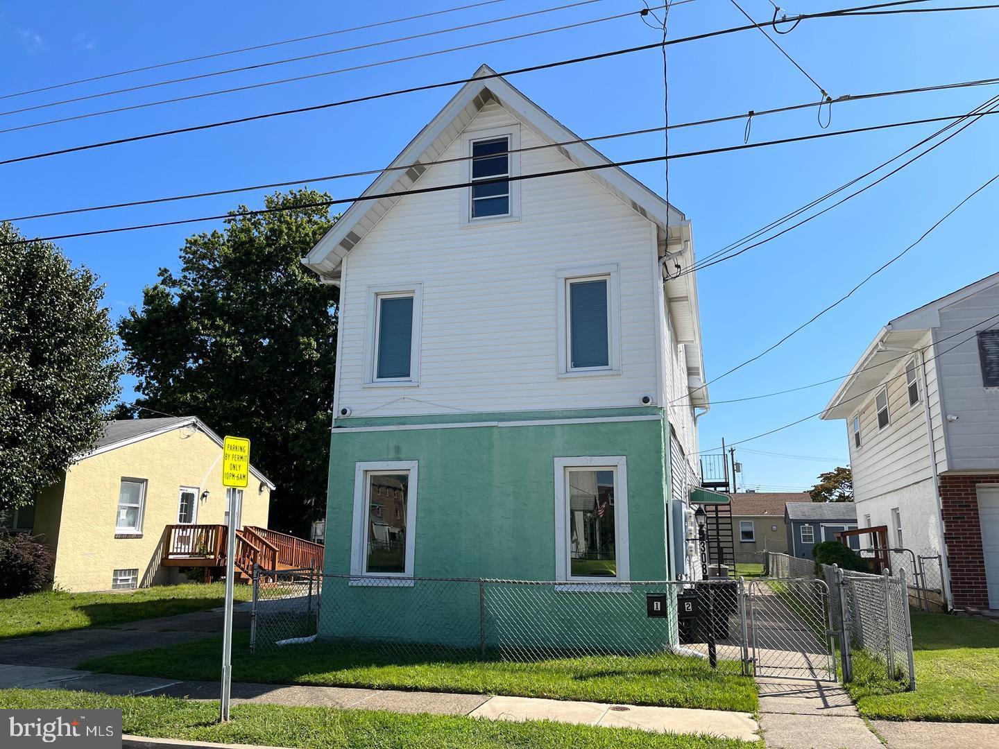 a view of a front of house with a yard