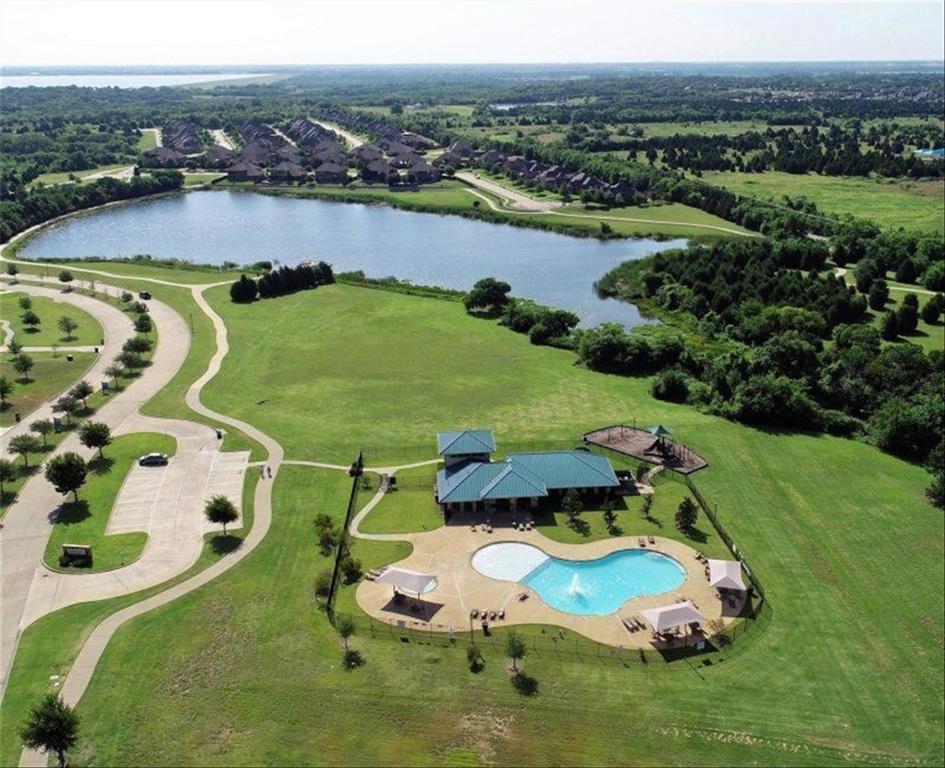 an aerial view of a house with outdoor space swimming pool