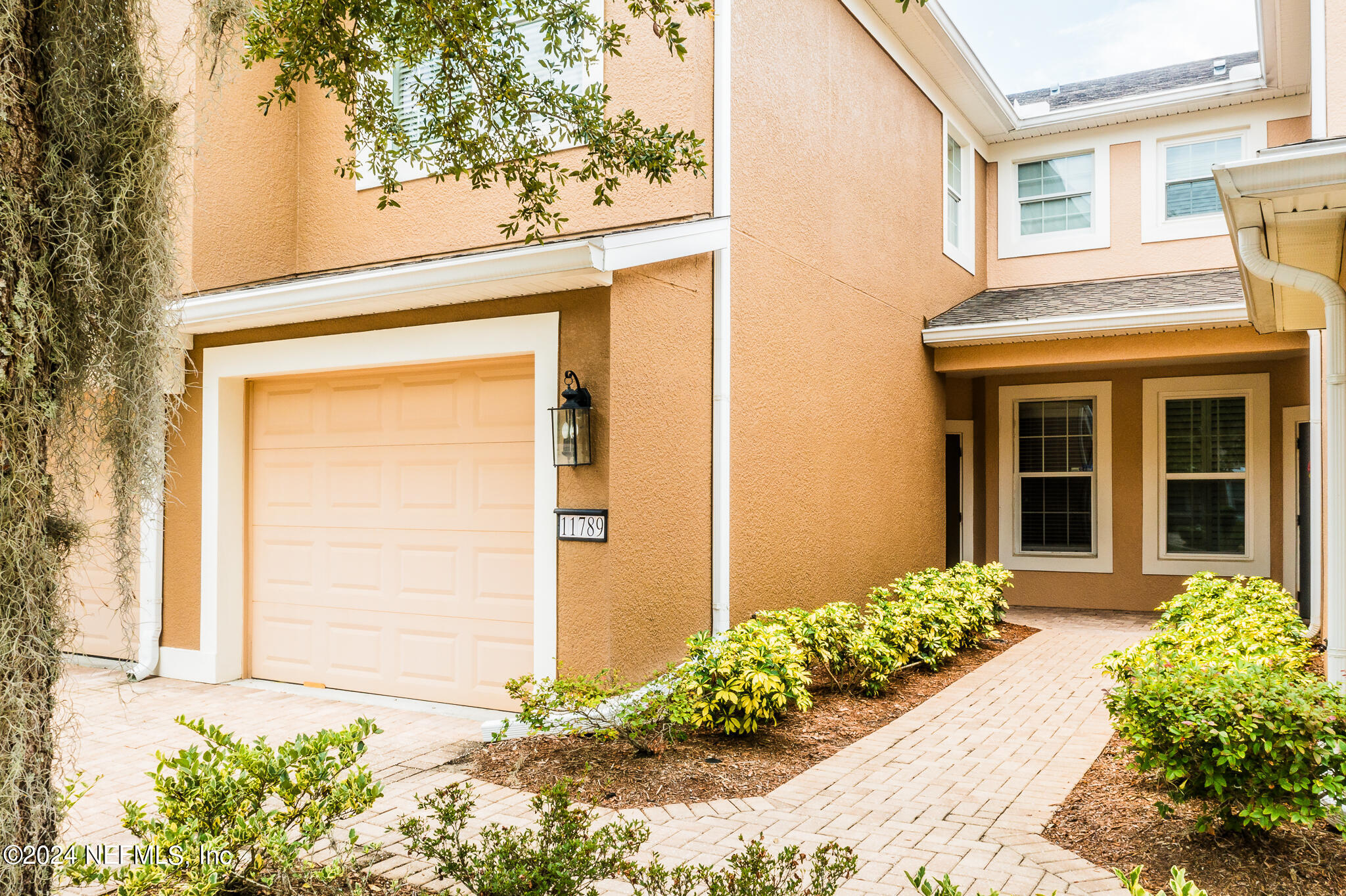 a front view of a house having yard