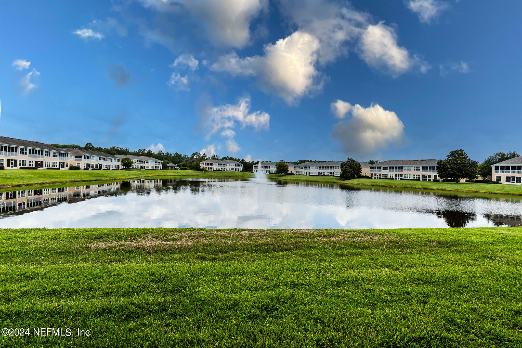 a view of a lake with a city