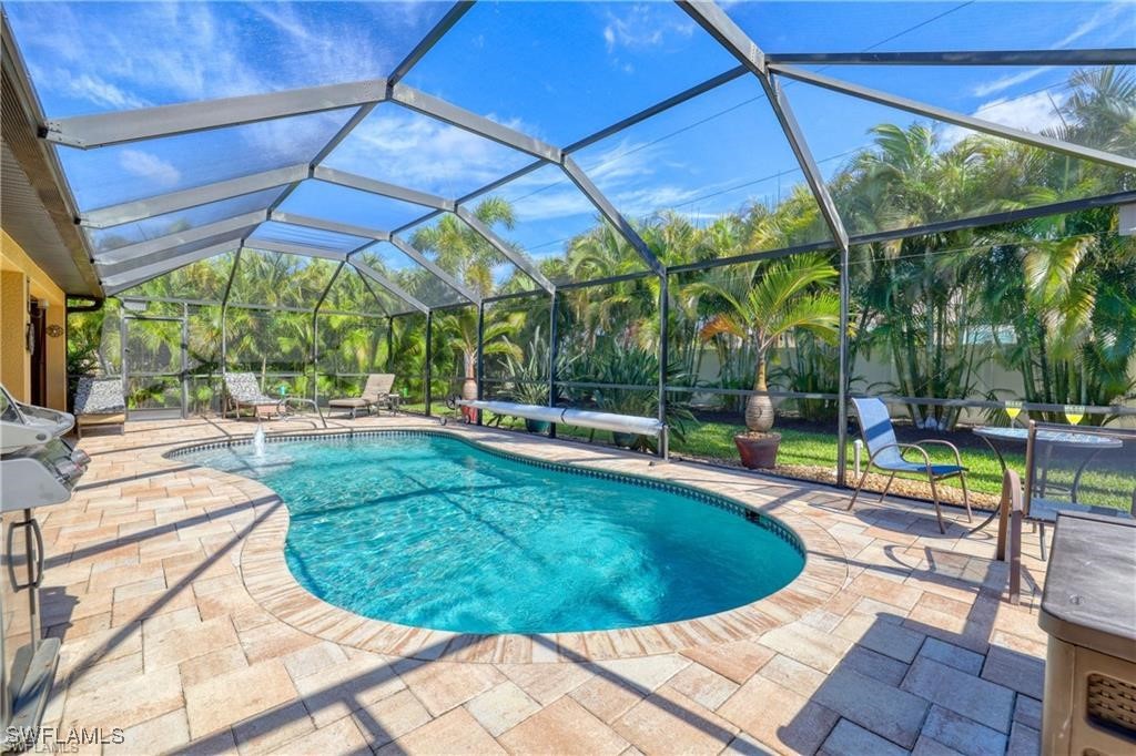 a view of a swimming pool with a patio