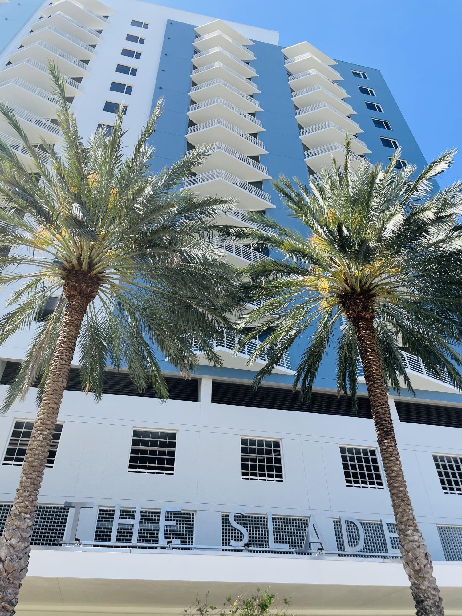 a view of a building with a palm tree