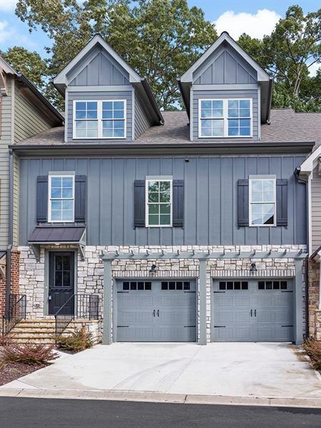 a front view of a house with a garage