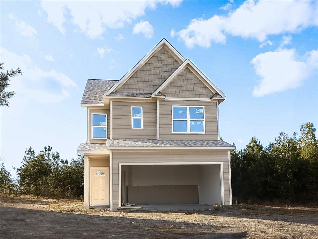 a front view of a house with a garage