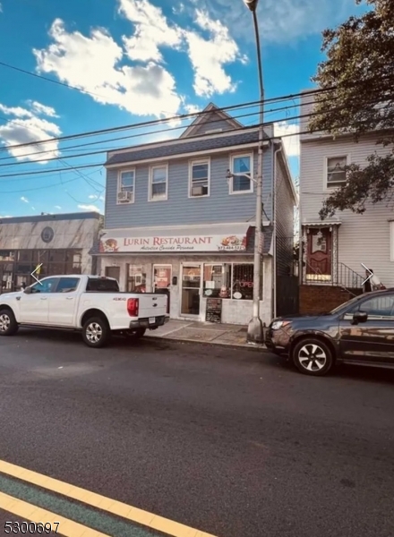 a view of a cars parked in front of a house