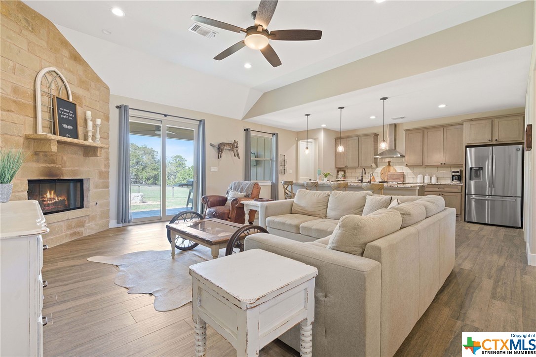 a living room with furniture and a fireplace