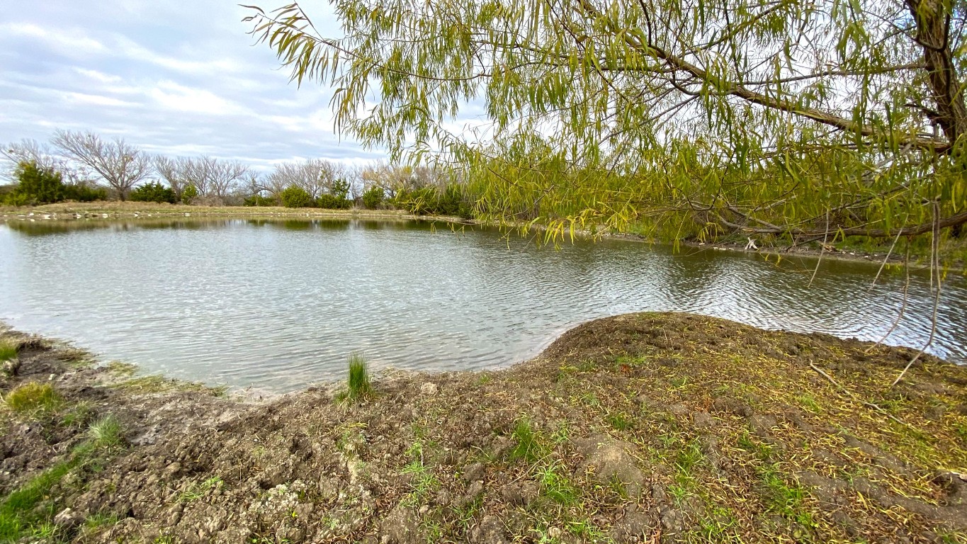 a view of a lake with a yard