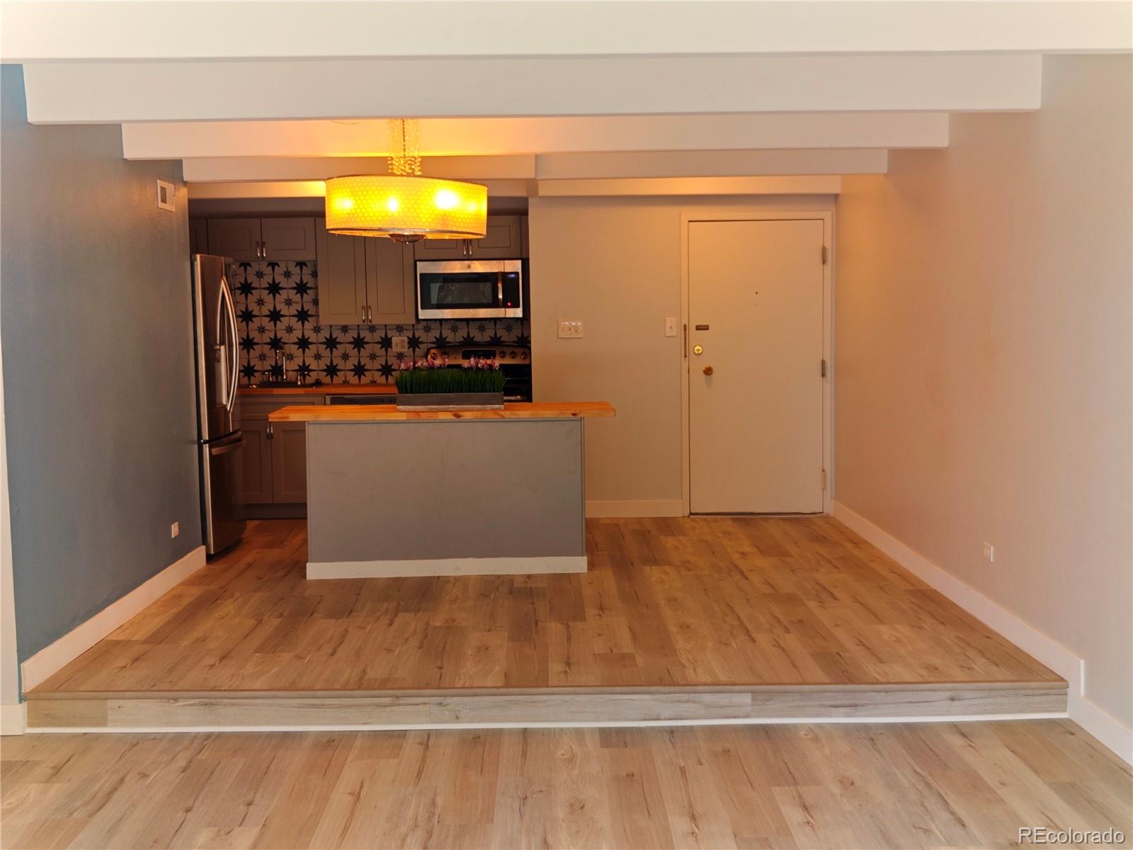 a view of entryway with wooden floor