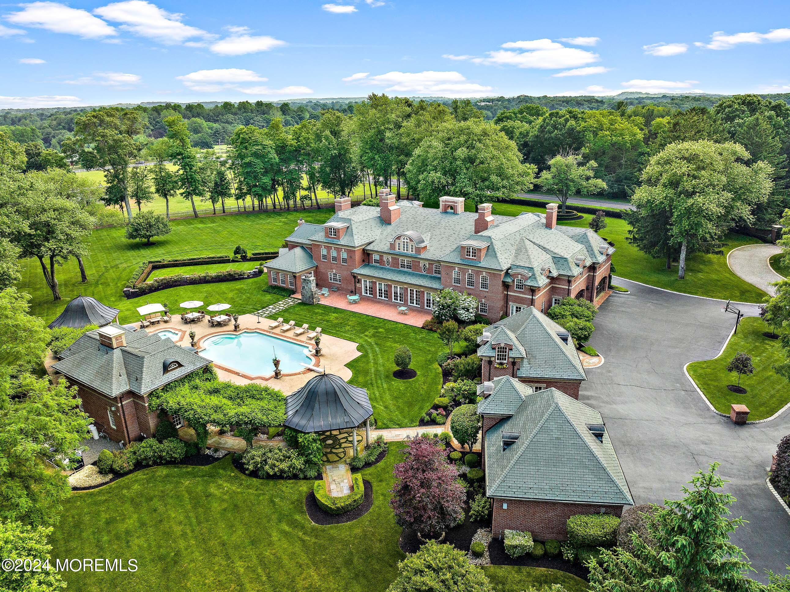 an aerial view of a house with garden space and street view