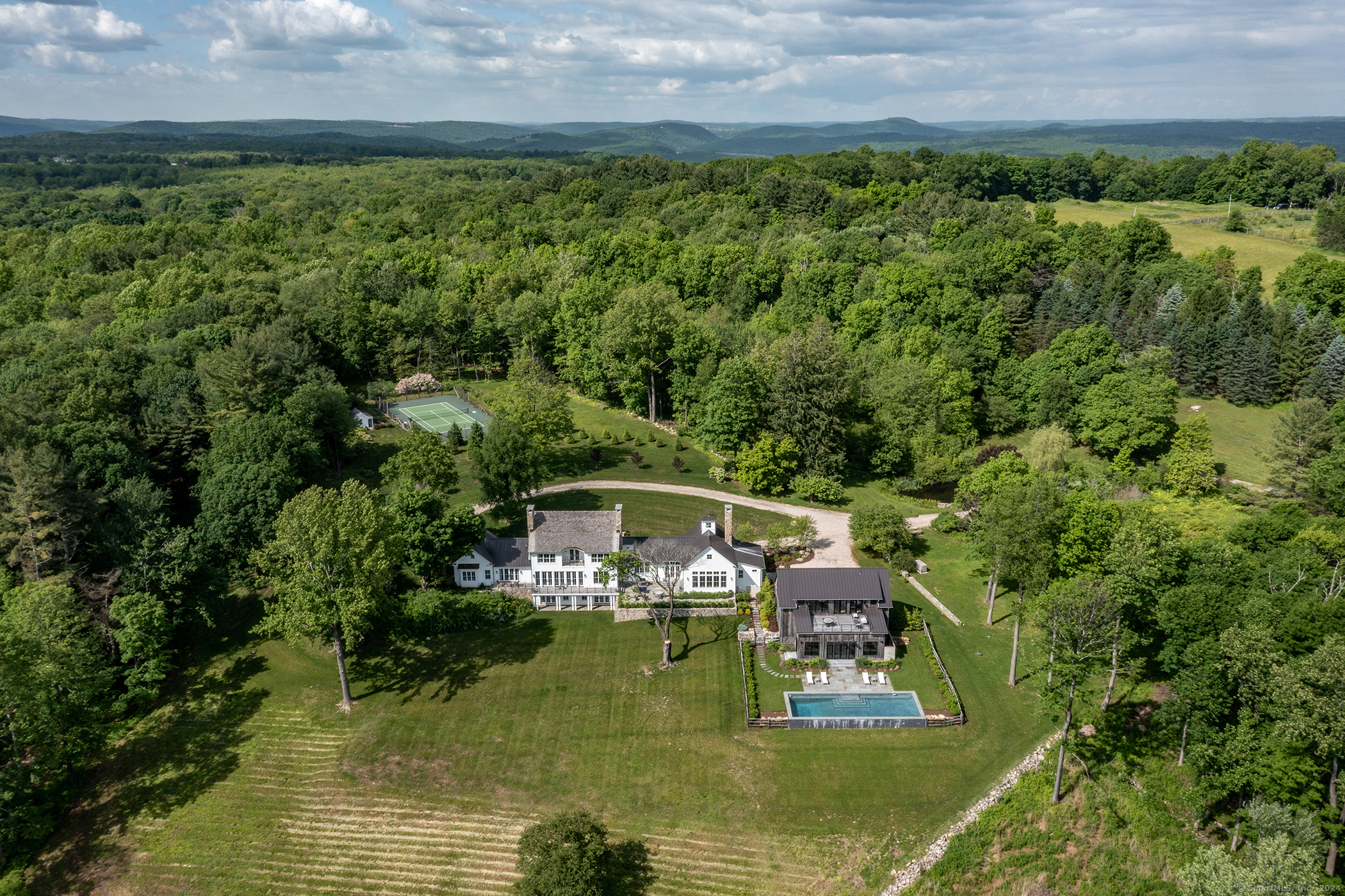 a view of house with swimming pool