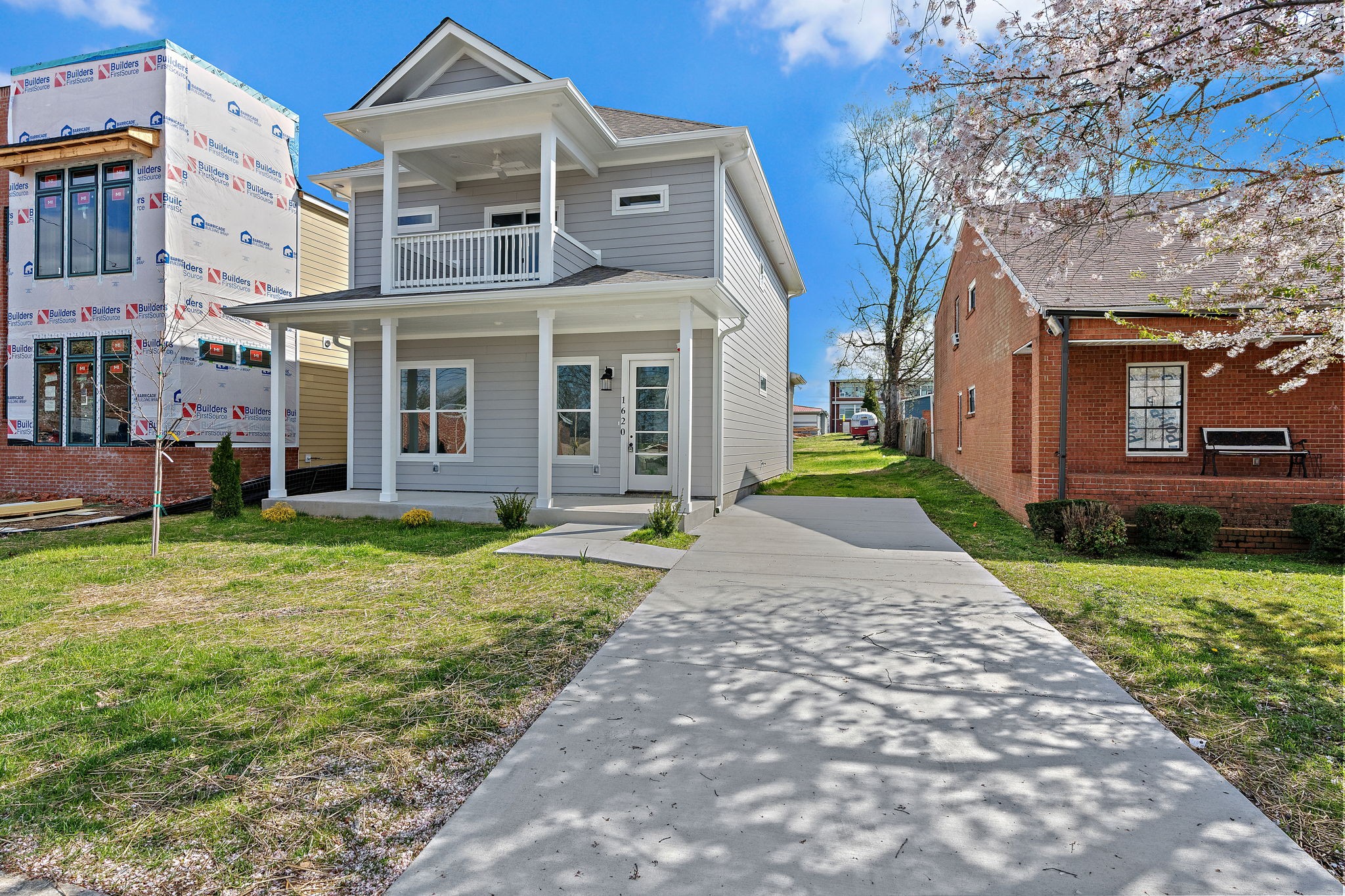 front view of a house with a yard