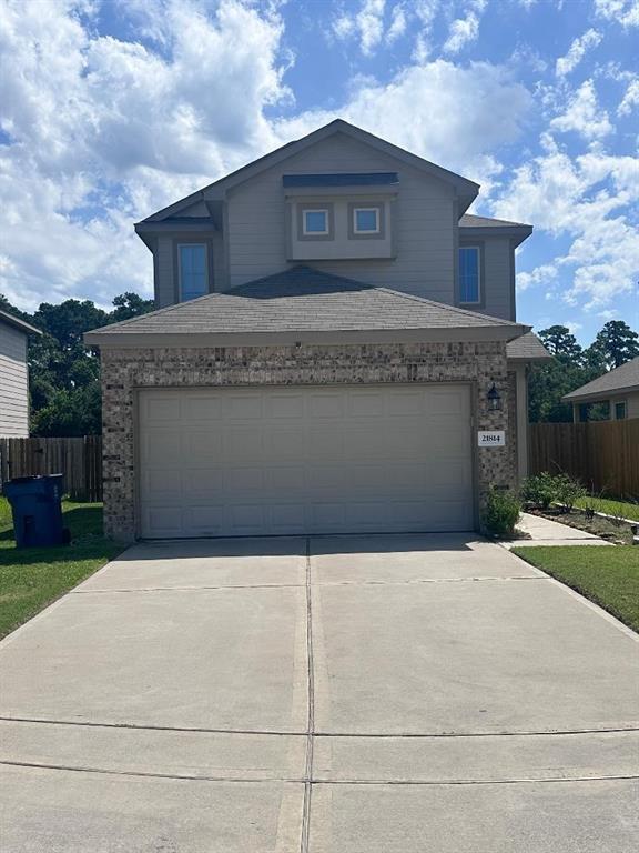 a front view of a house with yard