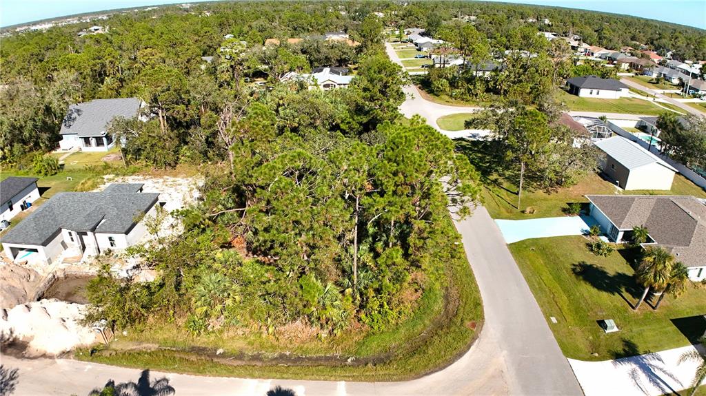 Aerial View of this large residential building site at the corner of Windsong Ave and Briant St, North Port, FL