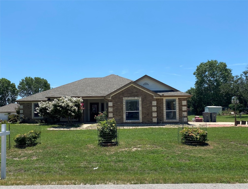 a view of a house with a yard porch and sitting area