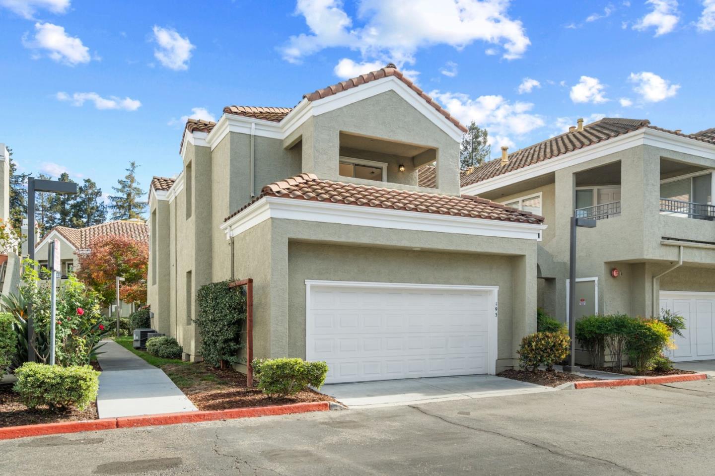 a front view of a house with a garage