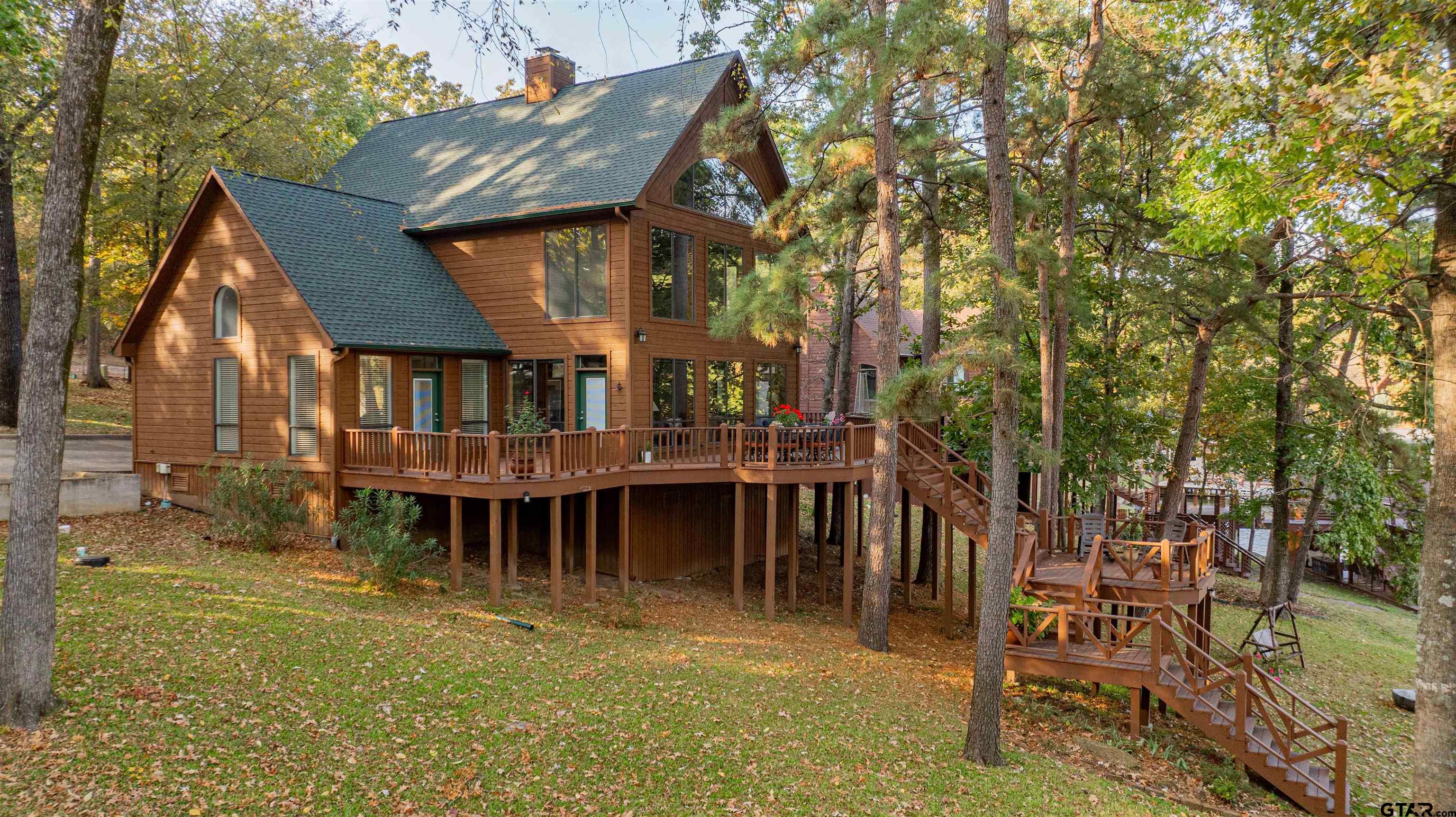 a view of a house with backyard porch and sitting area