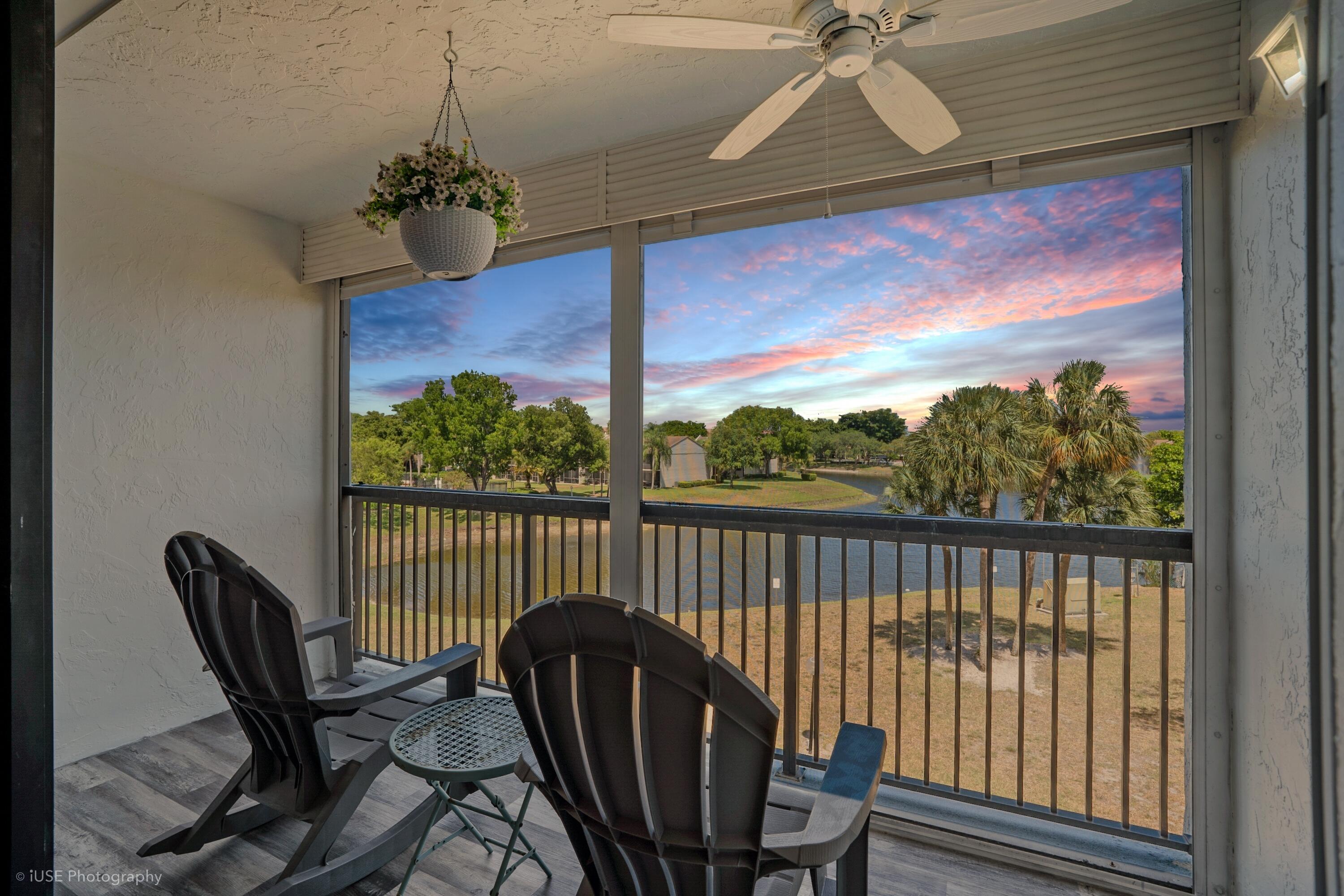 a view of a balcony with furniture