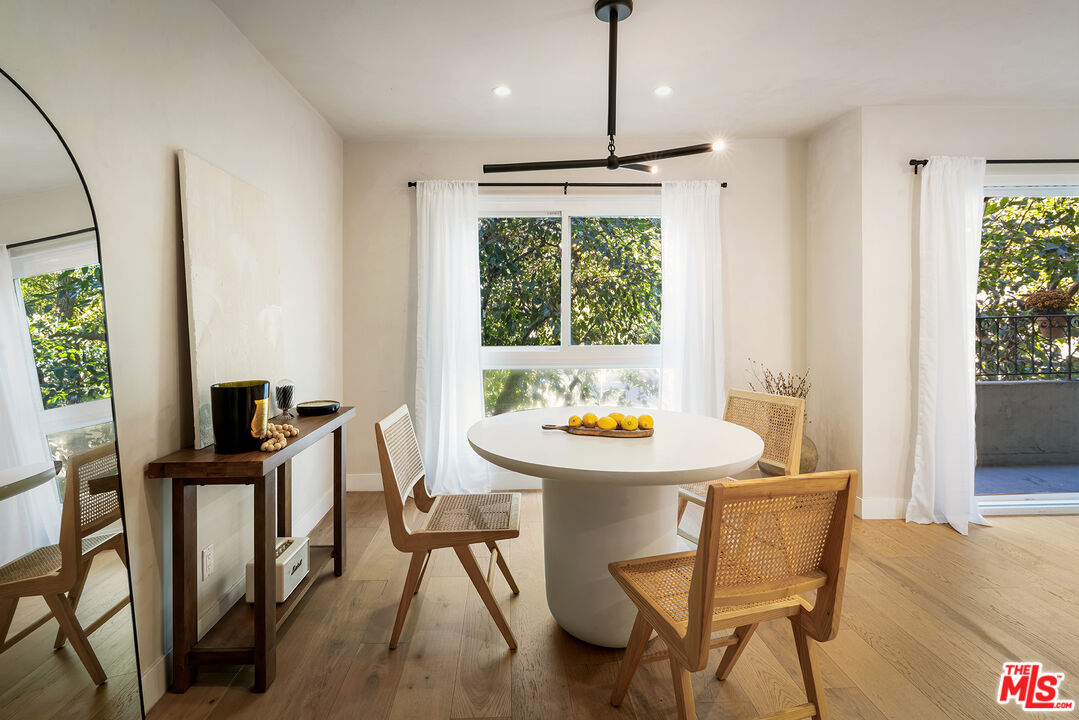 a view of a dining room with furniture window and outside view