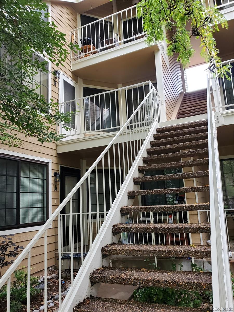 a view of a house with wooden stairs