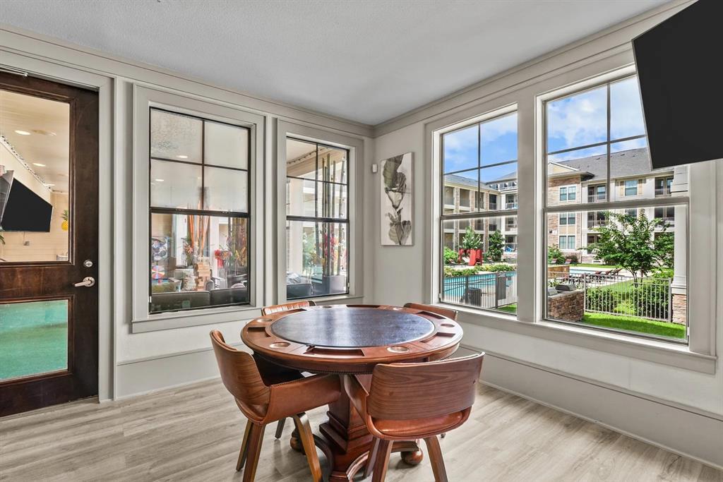 a dining room with furniture and windows