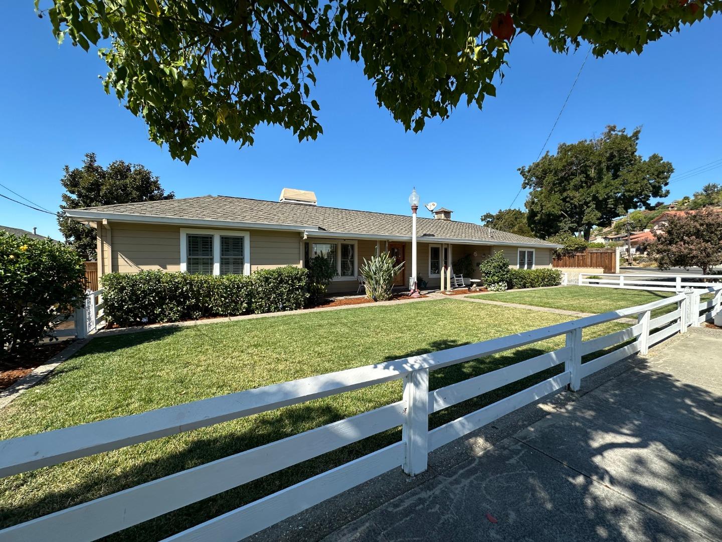 a view of a house with a yard porch and sitting area