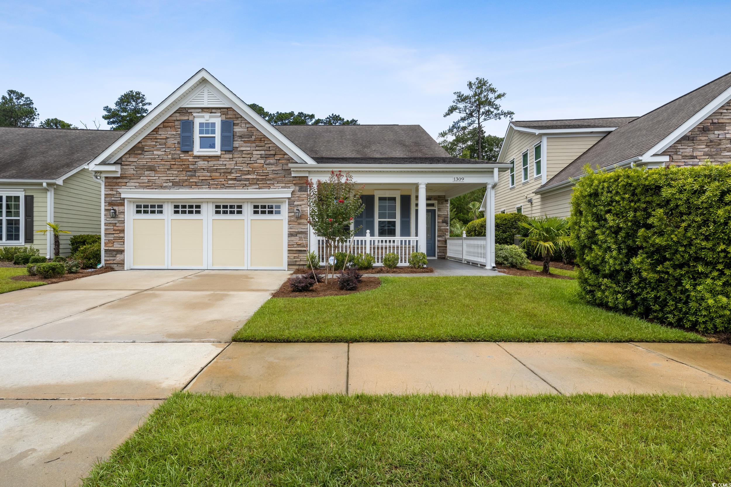 View of front of house featuring covered porch and