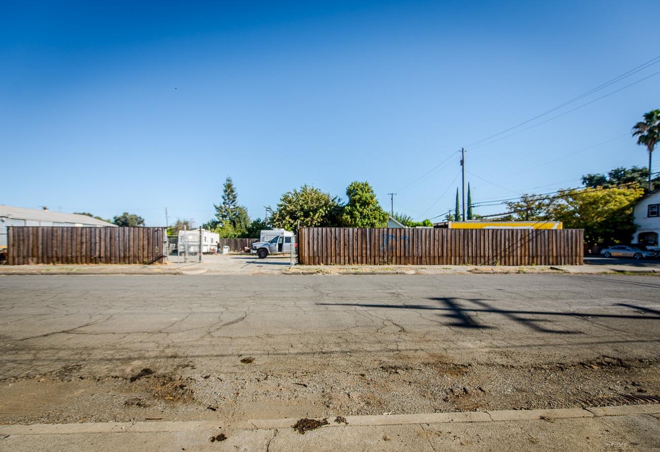 a street view with wooden fence