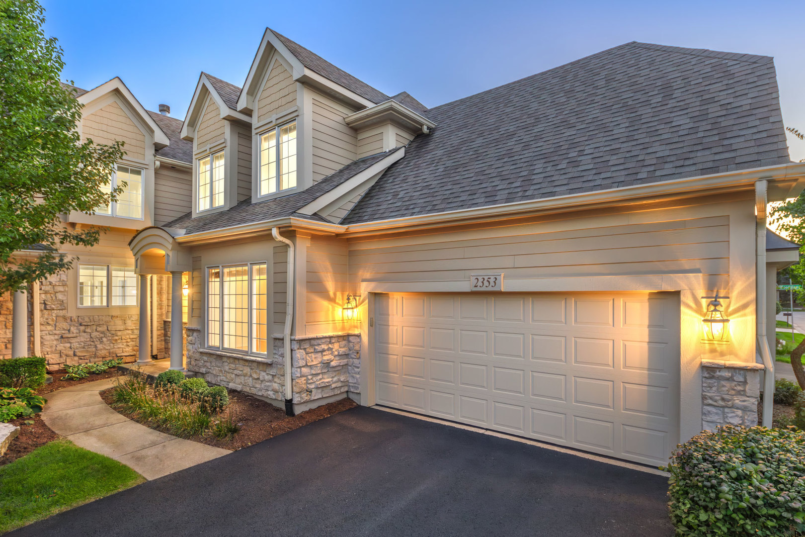 a front view of a house with a yard