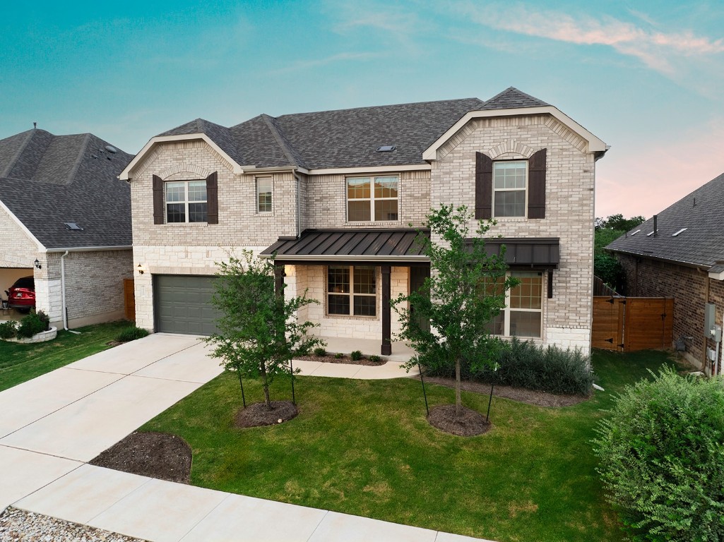 a front view of a house with a yard