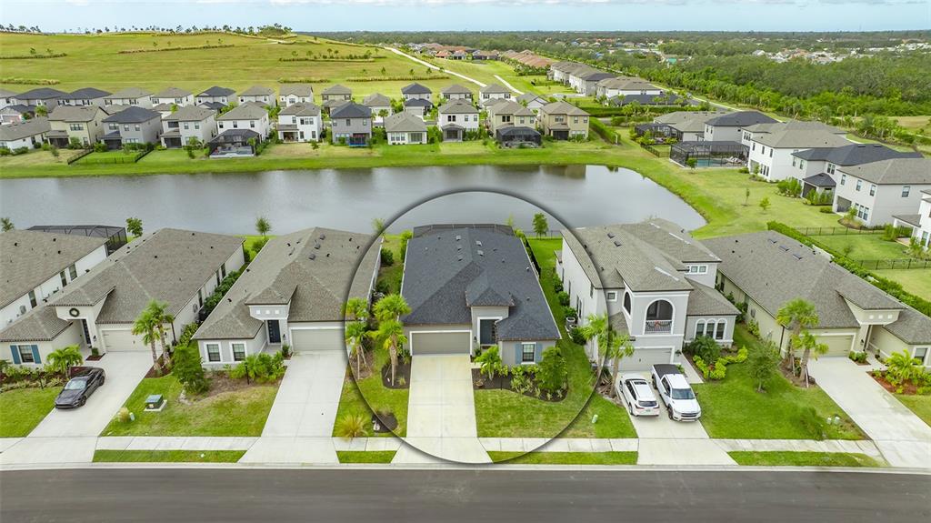 an aerial view of houses with yard