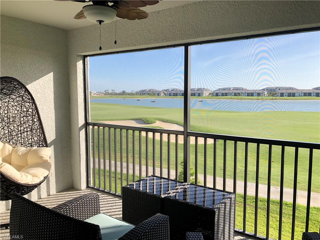 a view of a balcony with furniture