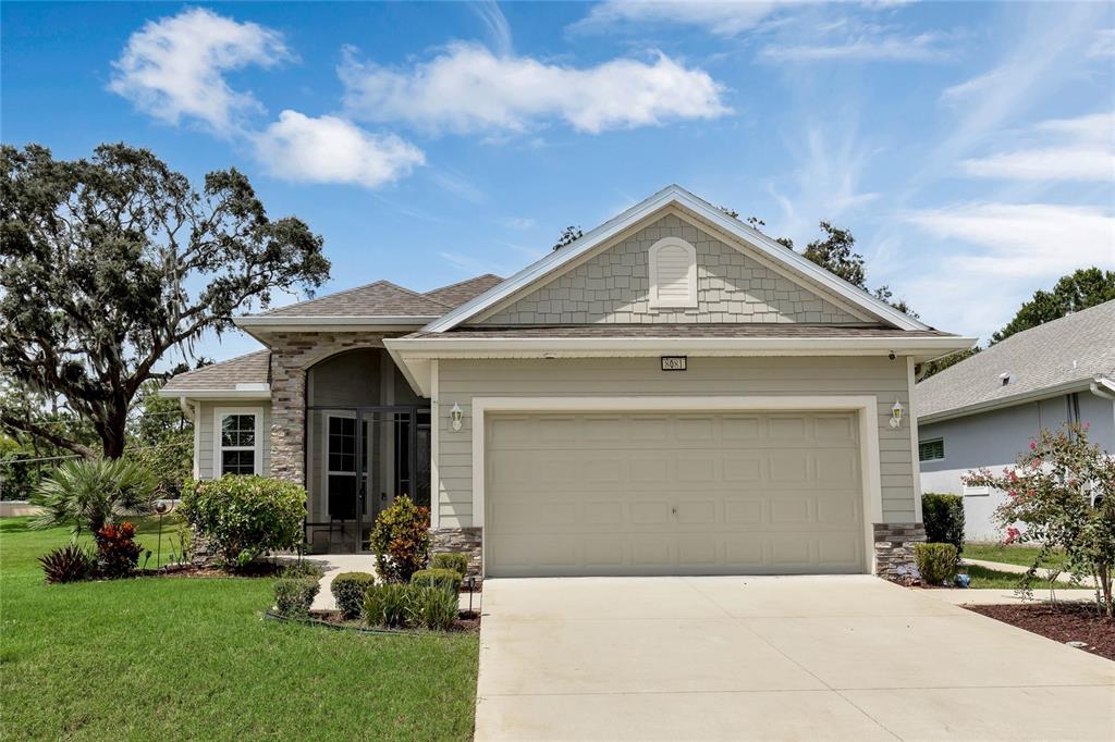 a front view of a house with a garden and entryway