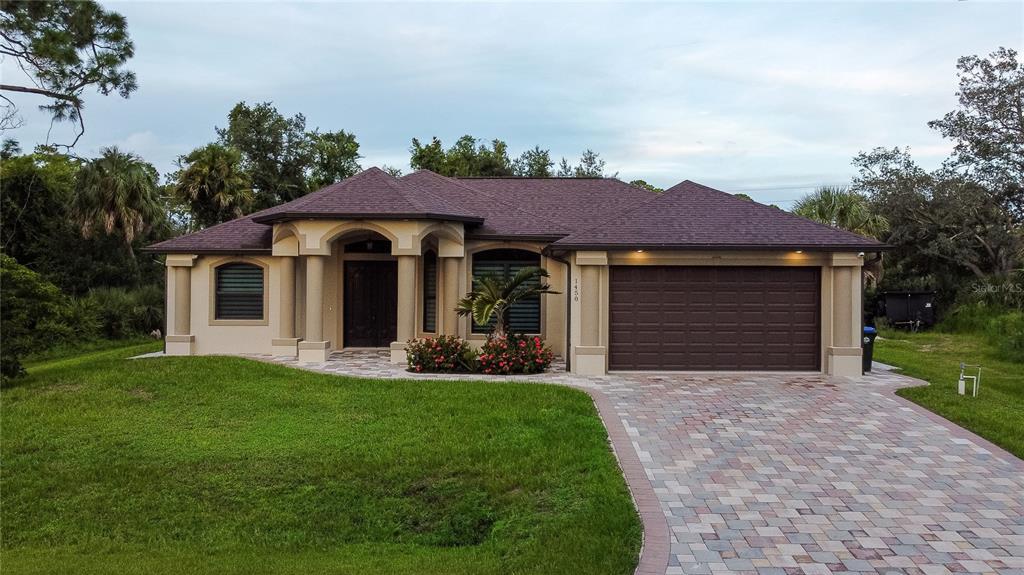 a front view of a house with a yard