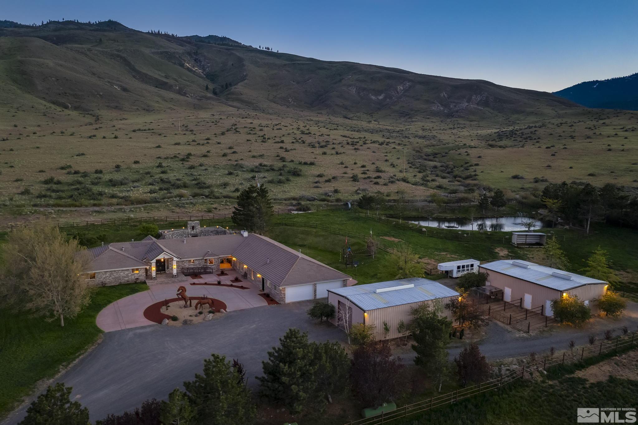 an aerial view of a house with mountain view