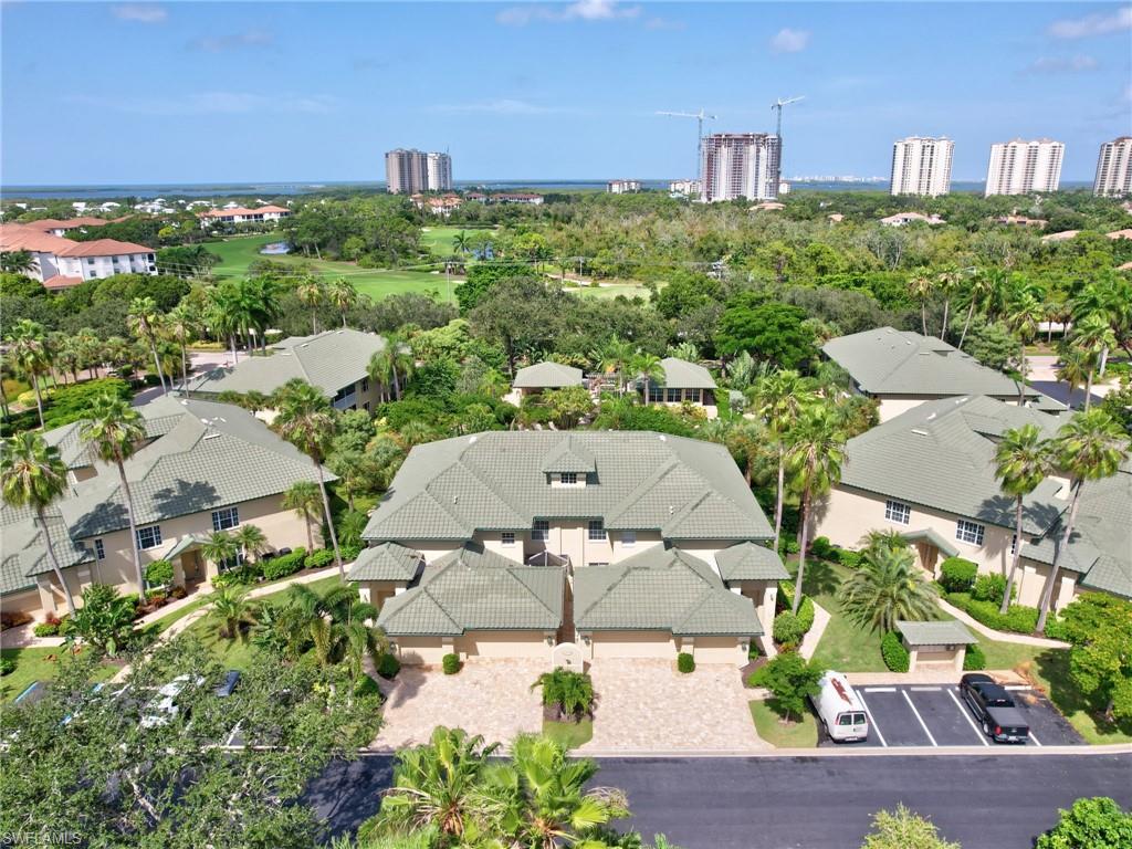 an aerial view of a house with a yard lake view and mountain view