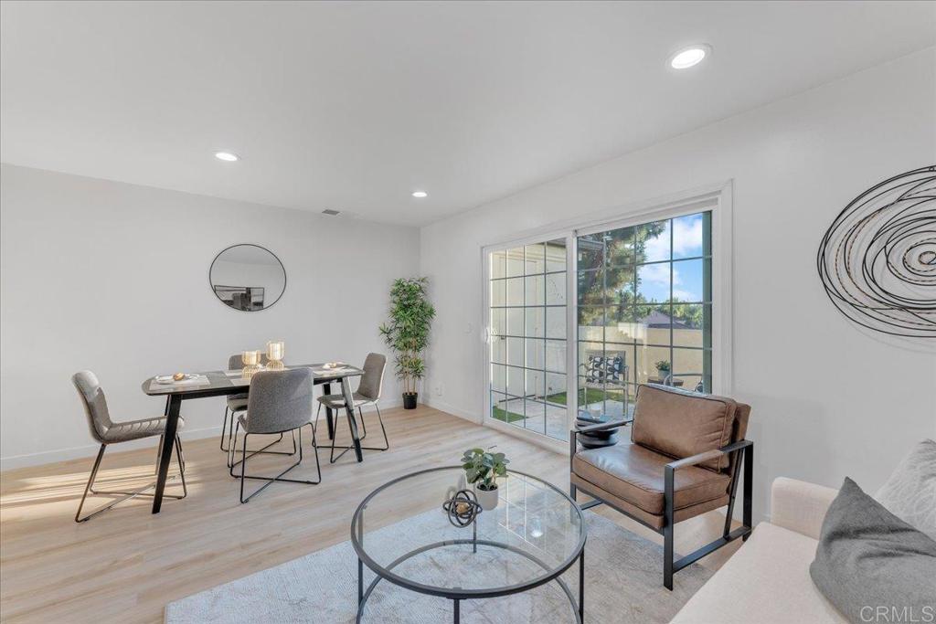 a living room with furniture potted plant and a window