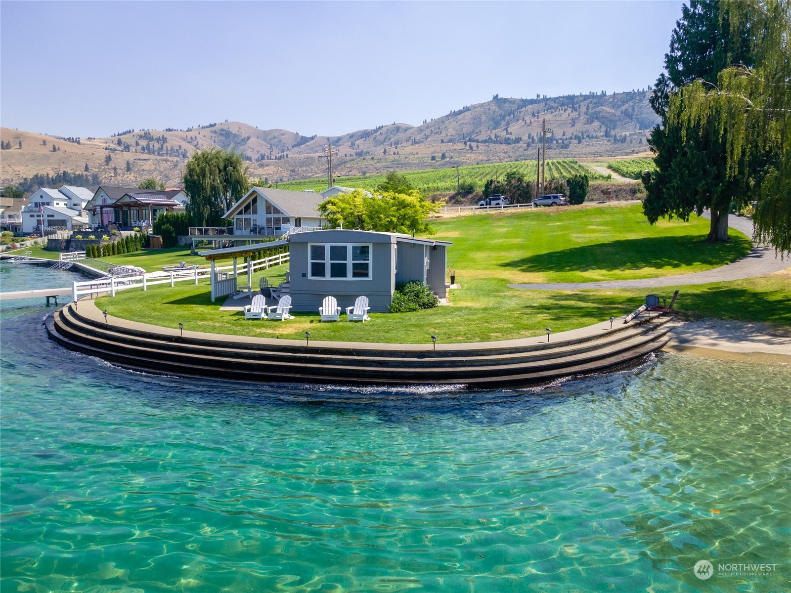 a view of swimming pool with a garden and mountain view