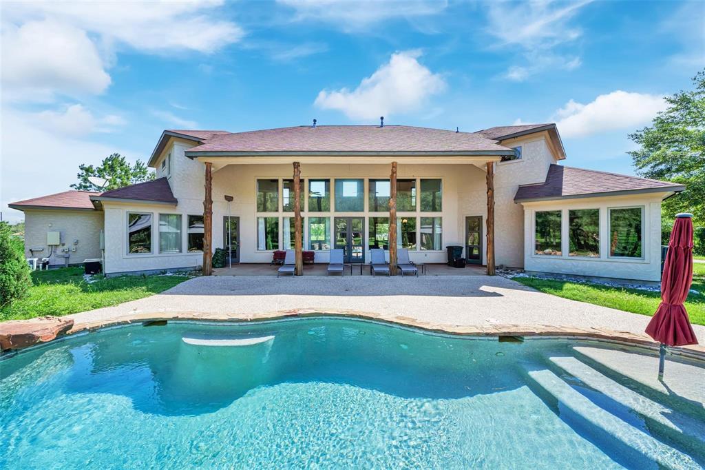 a view of a house with a swimming pool