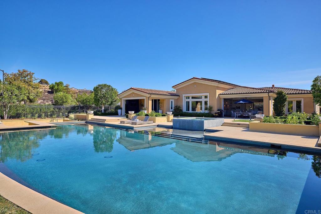 a front view of house with yard and outdoor seating