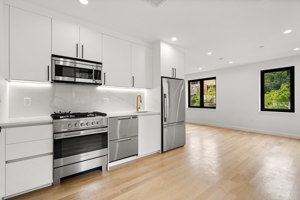 a kitchen with a stove and a microwave