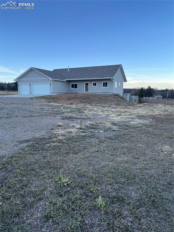 View of front of home featuring a garage