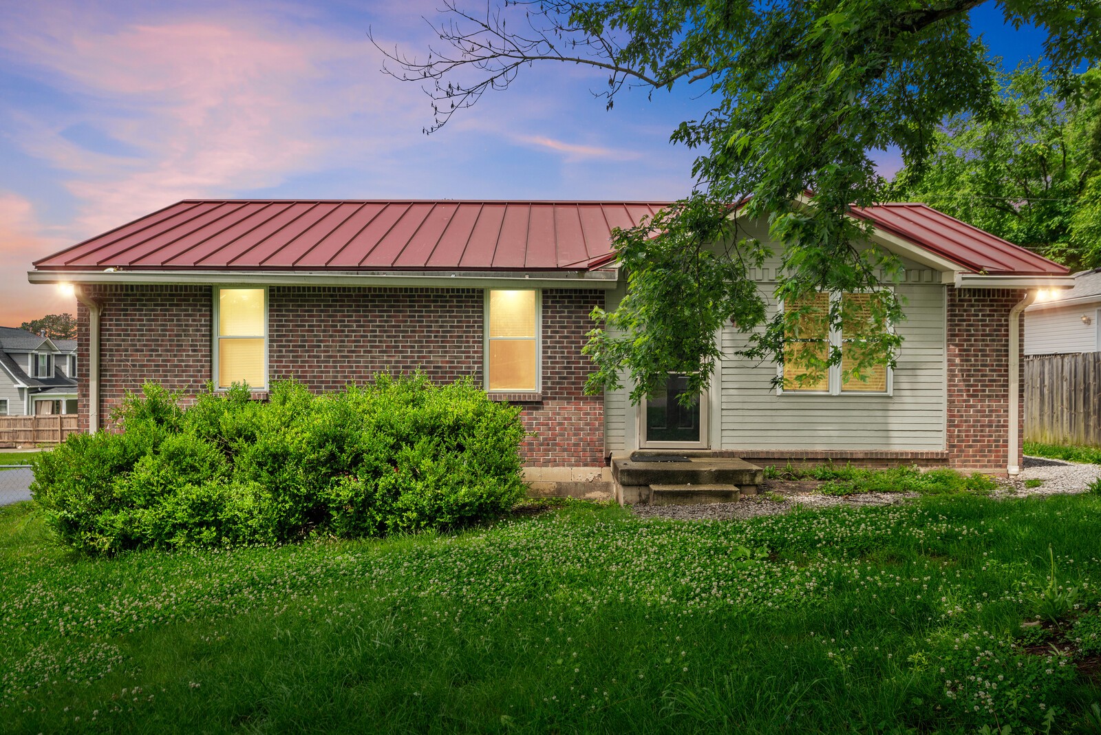 a front view of a house with a yard