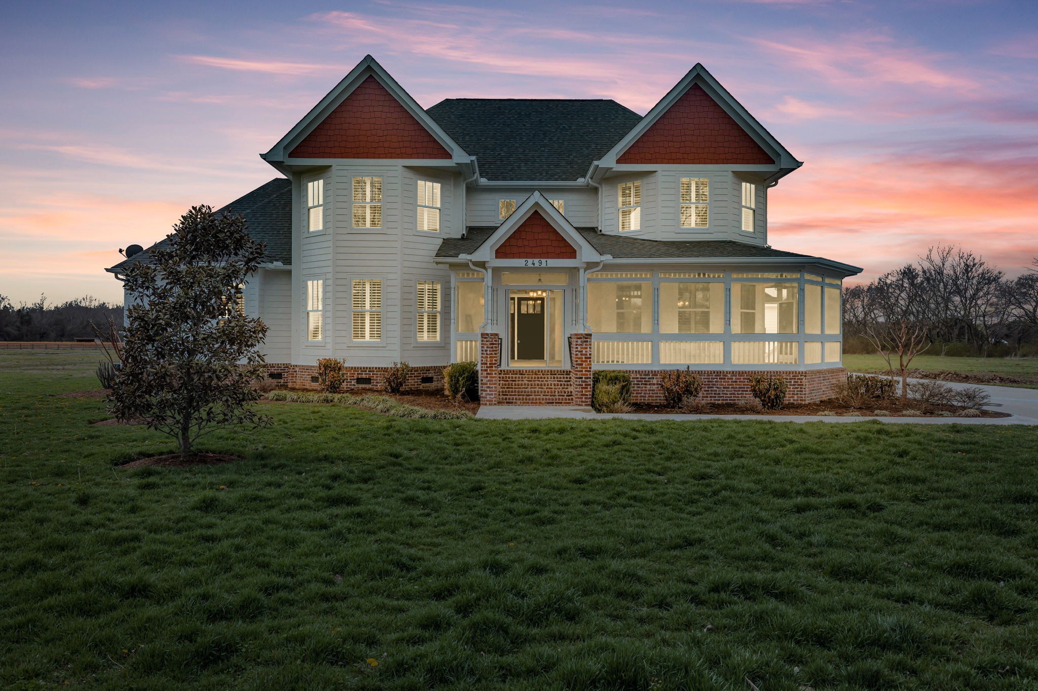 a front view of a house with a yard