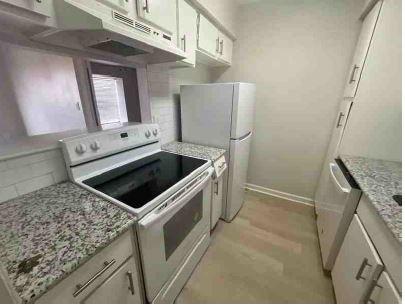 Kitchen with granite counters and recent appliances