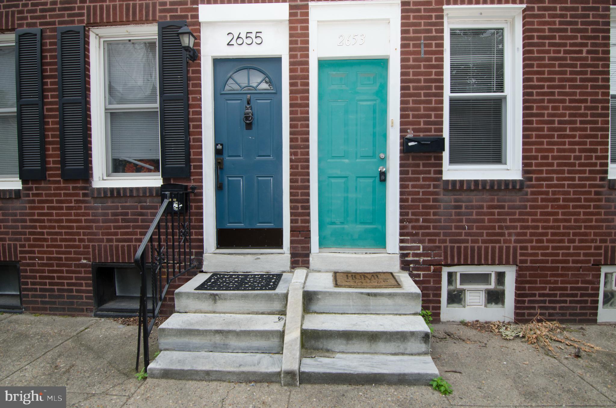 a front view of a house with a door and a window