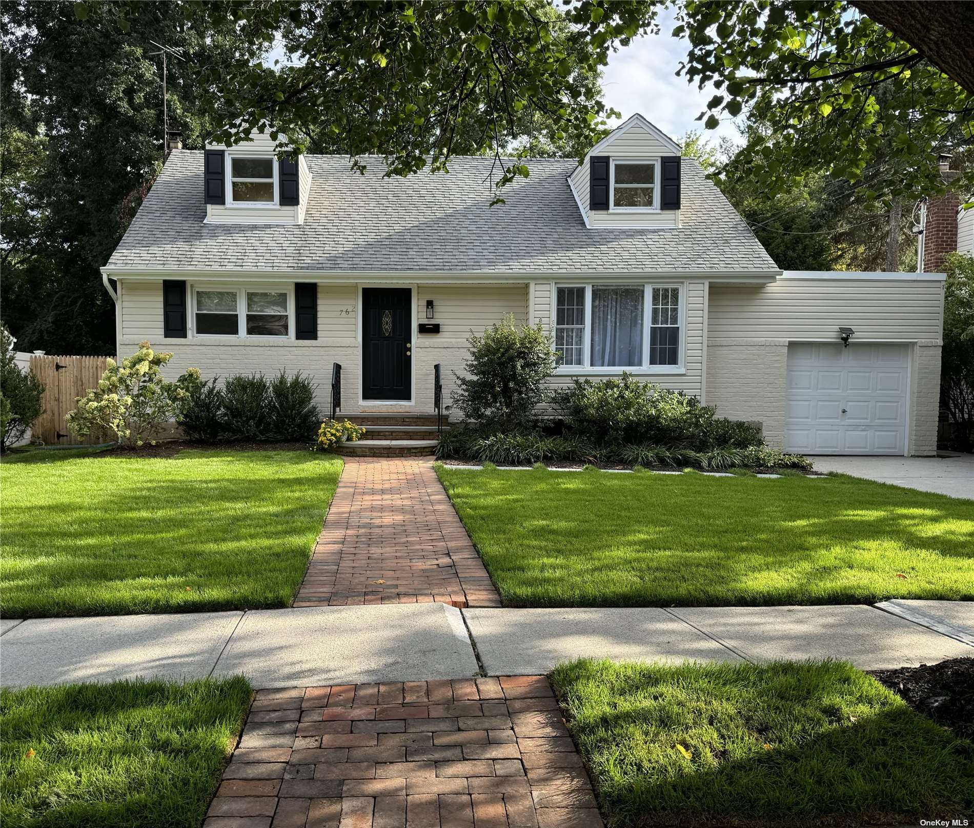 Wonderful curb appeal and perfect lawn!