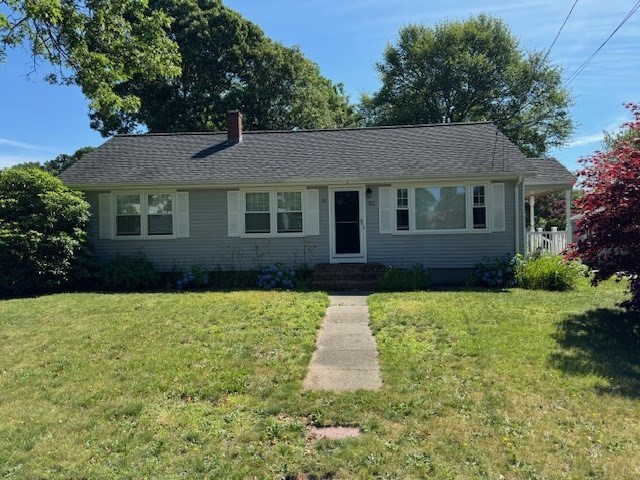 a front view of a house with yard