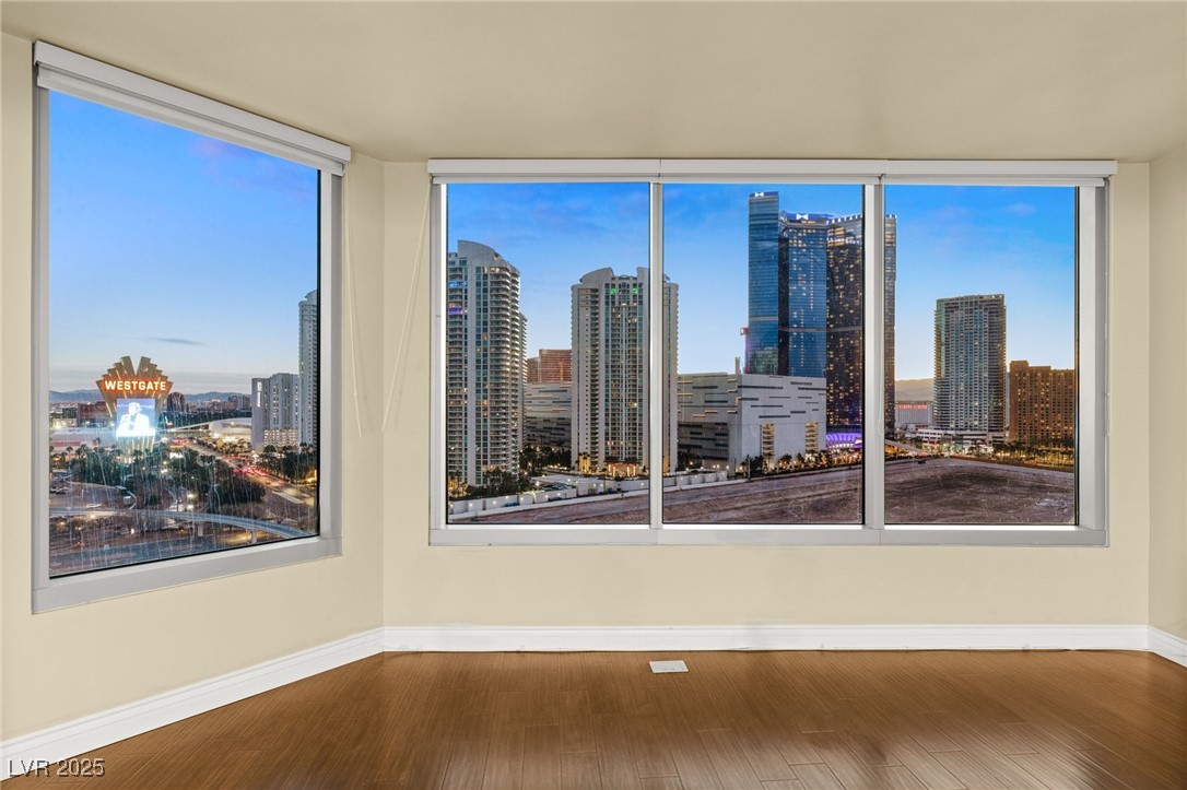 The living room features large windows with an uno